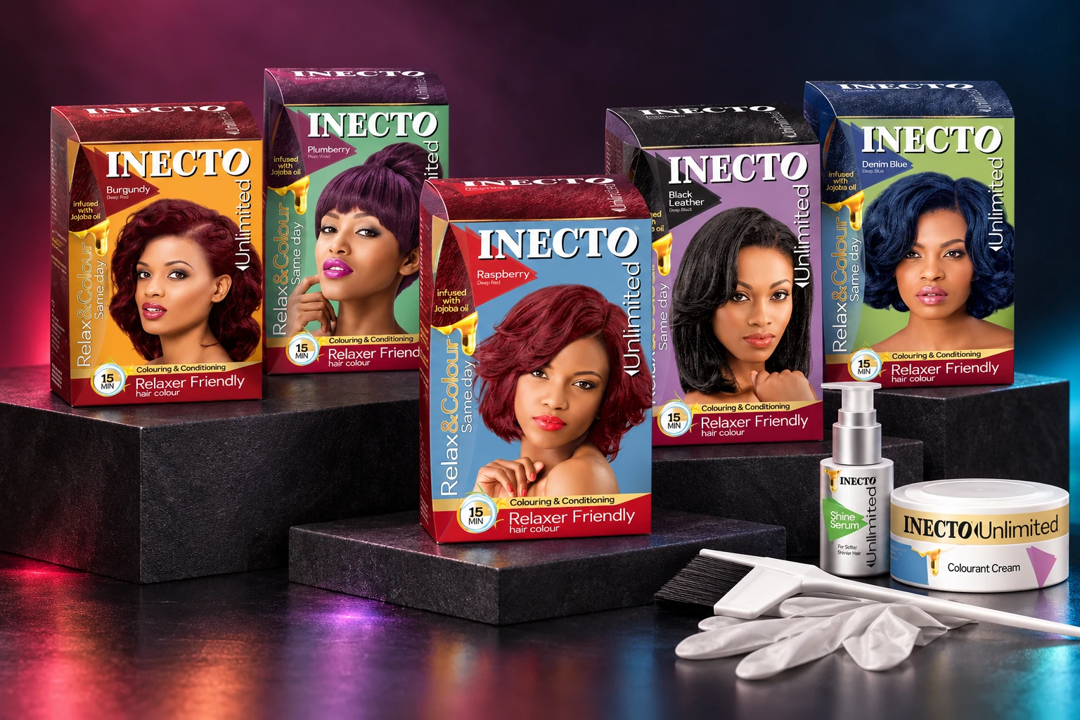 The five Inecto Unlimited hair-colour cartons arranged on studio plinths with the original shade portraits, shine serum and colourant-cream tub