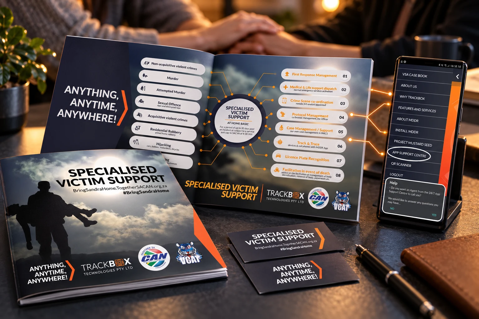 Specialised Victim Support booklet, coordinated service framework, printed identity and app screen in a compassionate support setting